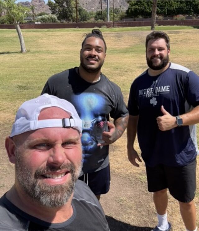Coach with trained athletes